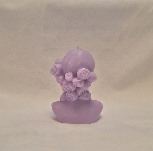 Handmade lavender soy wax girl bust candle with sculpted rose hair detail, perfect for gifts or home decor.